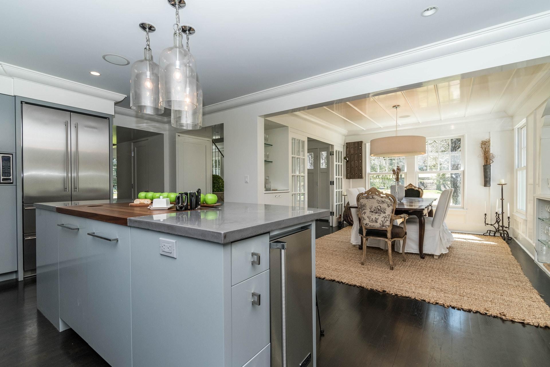 947 Valley Road New Canaan, CT 06840 - Photo 15 of 32 a kitchen with counter top space and dining table
