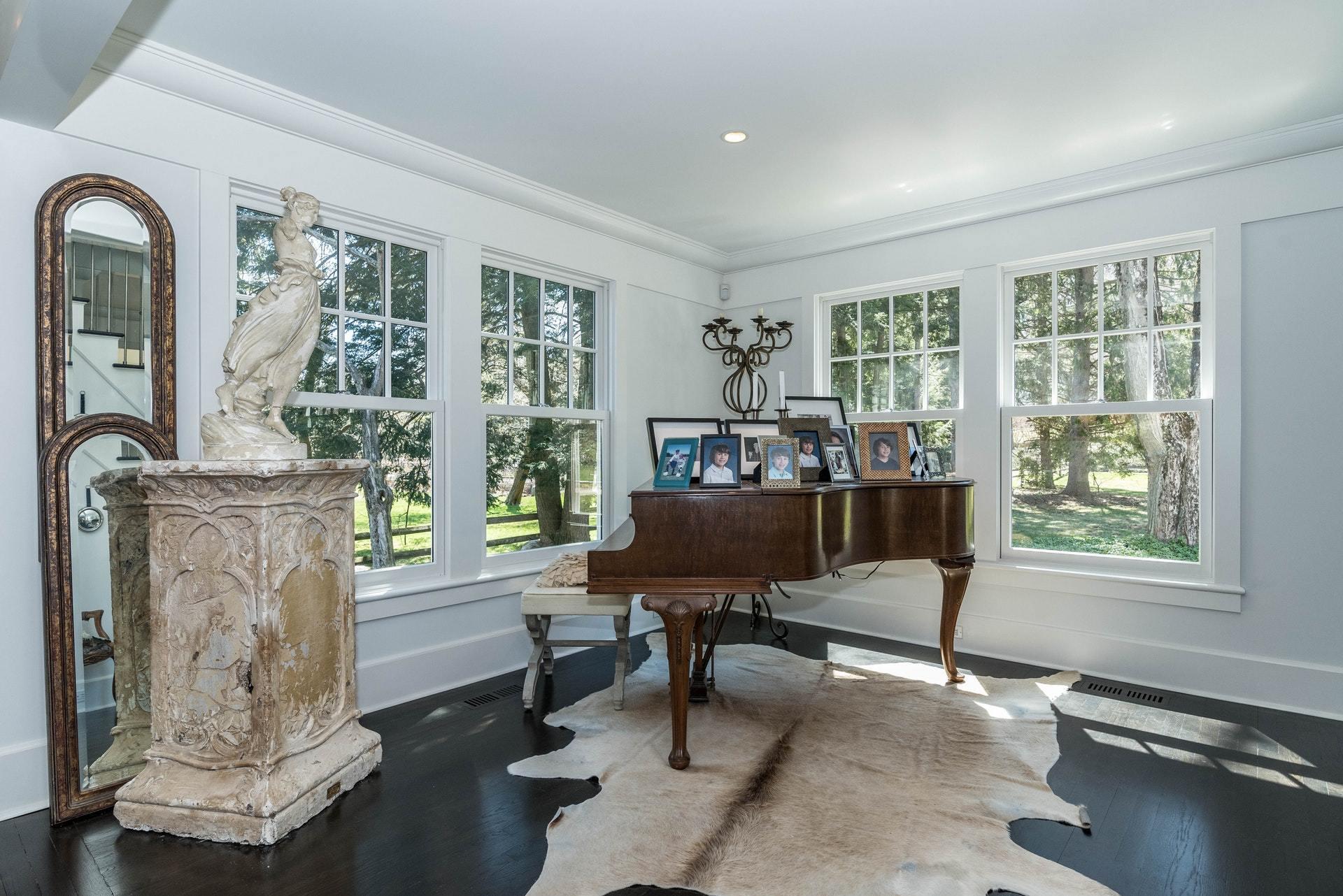 947 Valley Road New Canaan, CT 06840 - Photo 17 of 32 a living room with furniture and a window