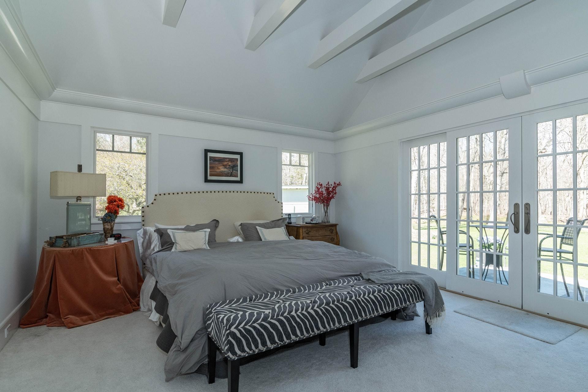 947 Valley Road New Canaan, CT 06840 - Photo 20 of 32 a bedroom with a bed and a couch