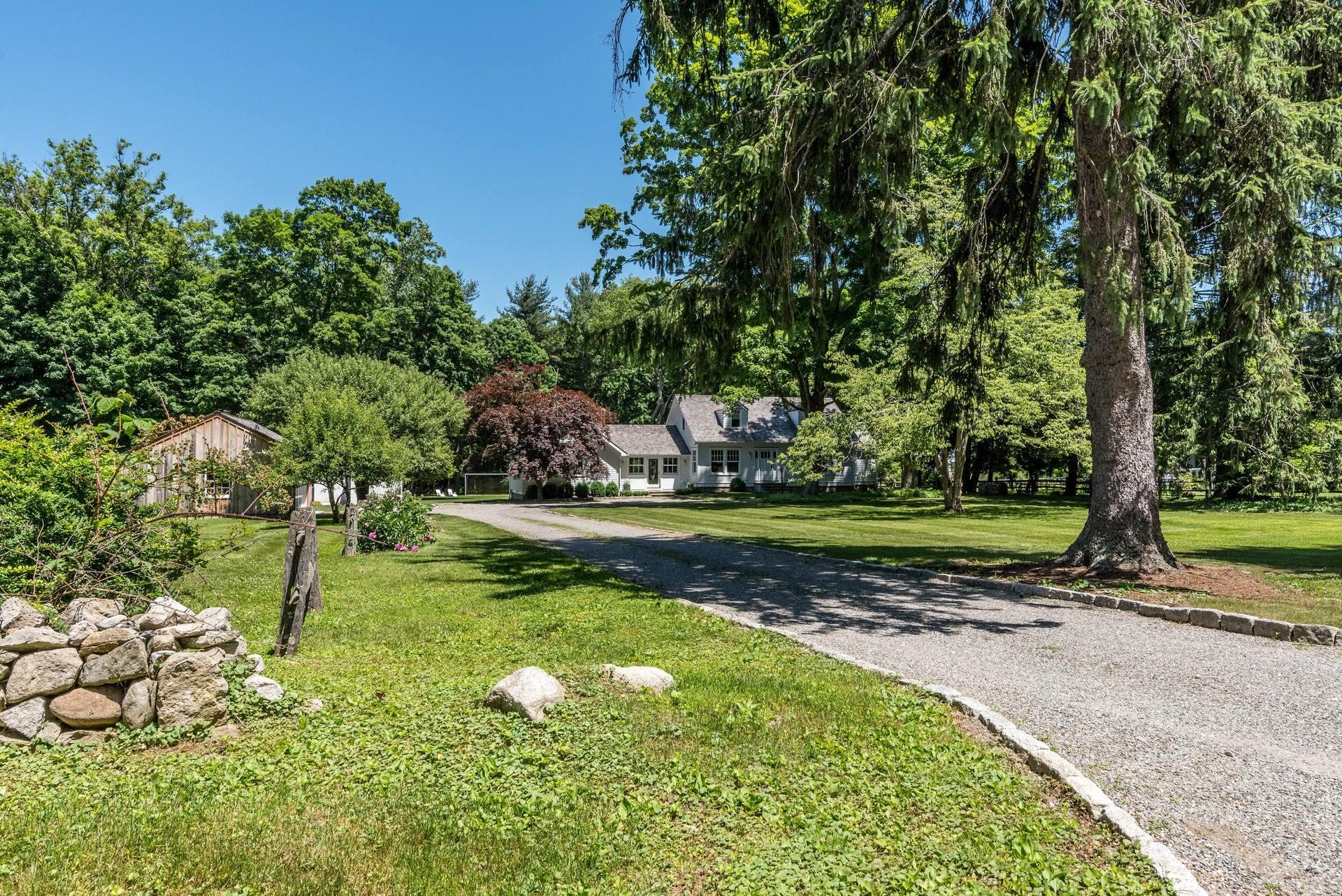 947 Valley Road New Canaan, CT 06840 - Photo 2 of 32 a view of a park with large trees