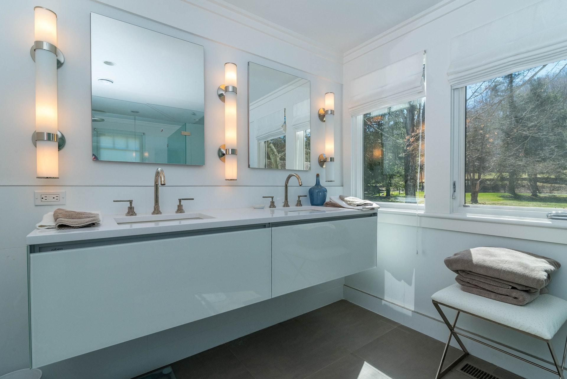 947 Valley Road New Canaan, CT 06840 - Photo 22 of 32 a bathroom with a sink and a mirror