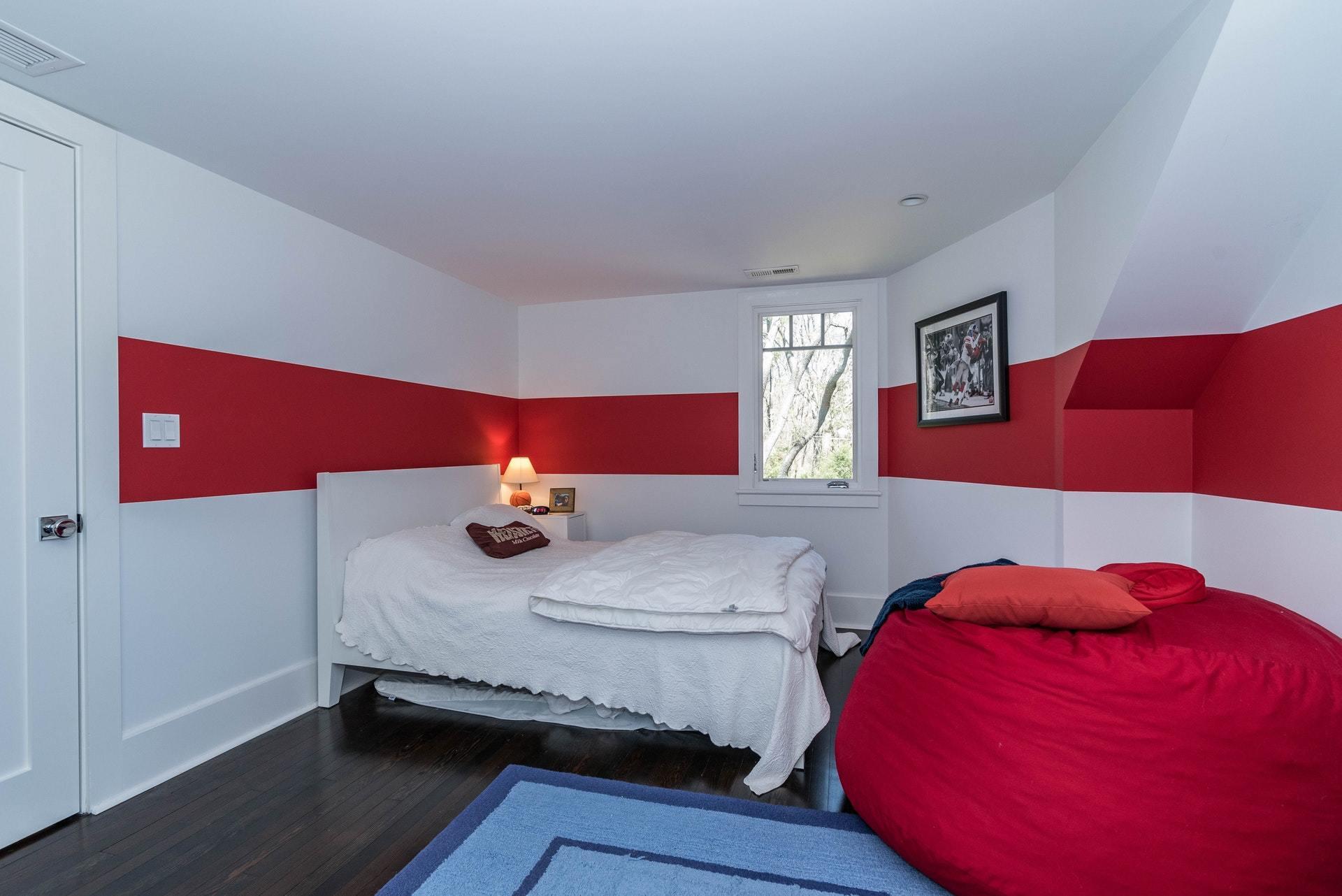 947 Valley Road New Canaan, CT 06840 - Photo 26 of 32 a bedroom with a bed and window