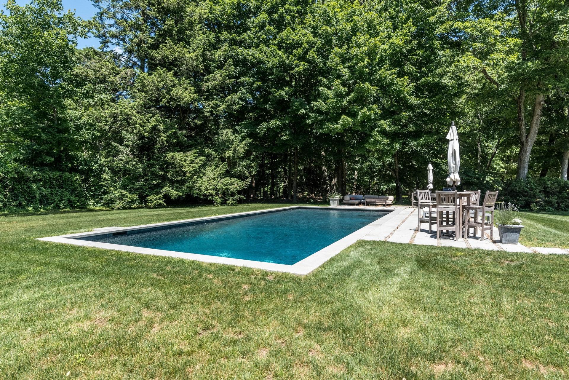 947 Valley Road New Canaan, CT 06840 - Photo 30 of 32 a view of a swimming pool with a yard