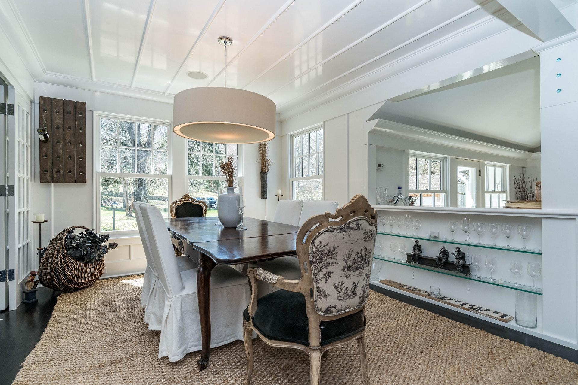 947 Valley Road New Canaan, CT 06840 - Photo 10 of 32 a view of a dining room with furniture and a chandelier