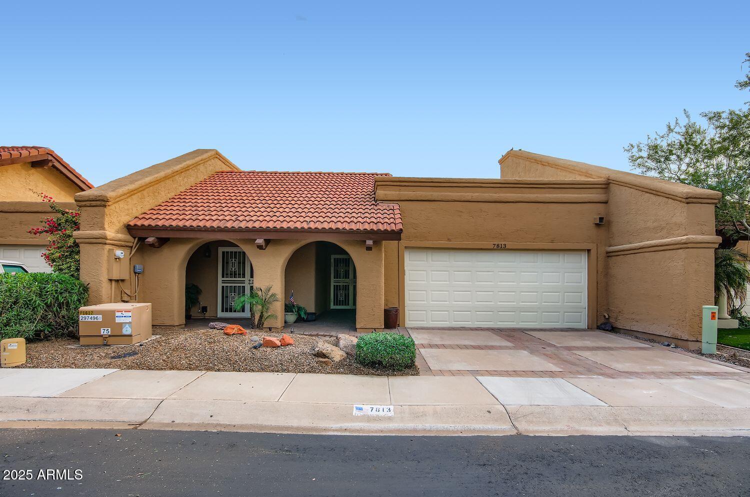 a front view of a house with yard
