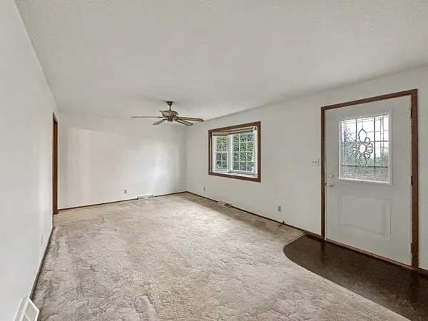a view of an empty room with a window