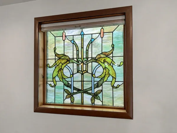 a view of a room with wooden floor and door