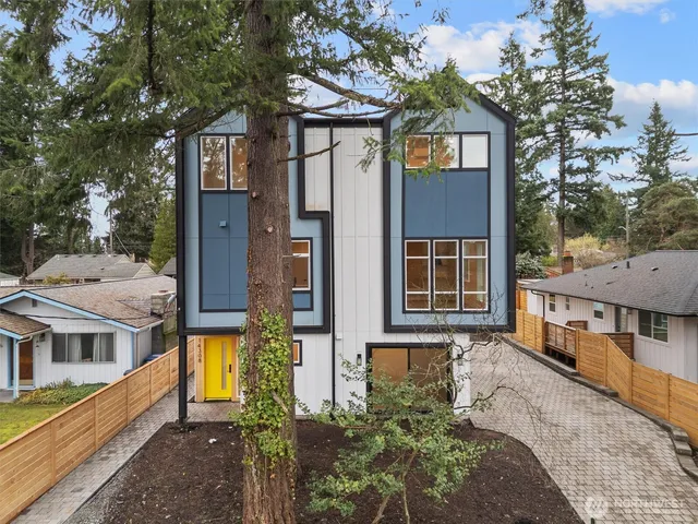 a front view of a house with large windows