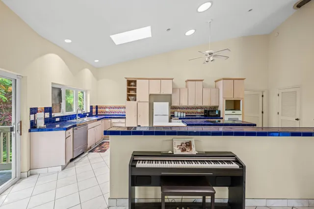 a kitchen with sink stove and cabinets