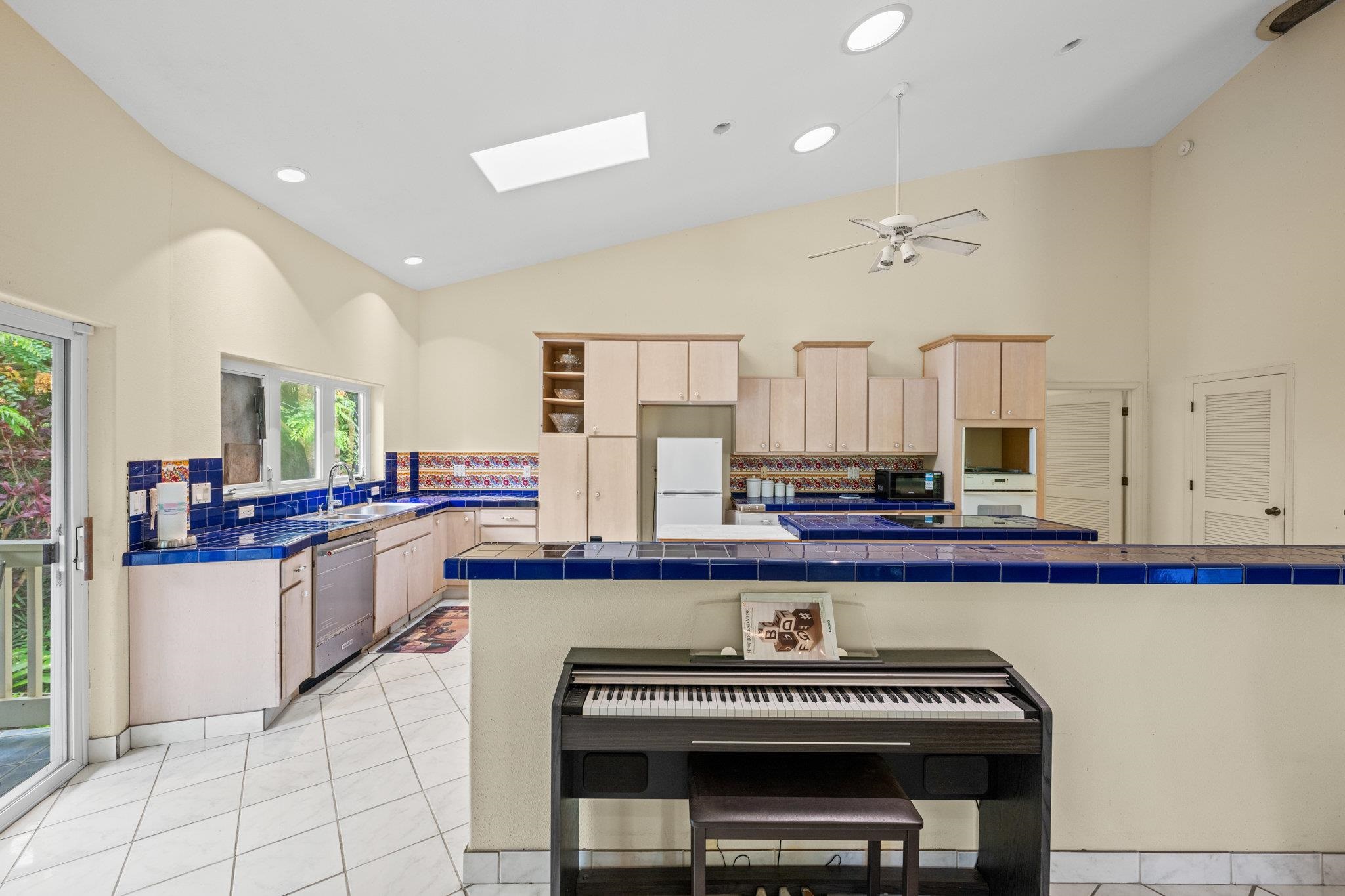 155 Uwala Road Hana, HI 96713 - Photo 14 of 41 a kitchen with sink stove and cabinets