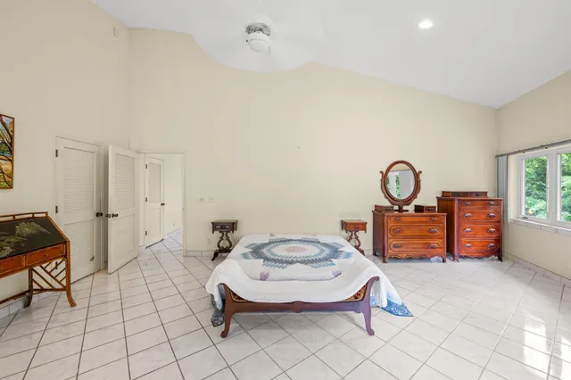 a living room with furniture a rug and a window
