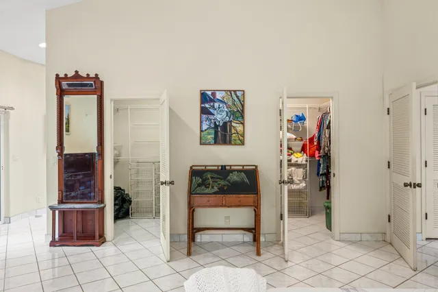 a lobby with a double vanity sink and mirror