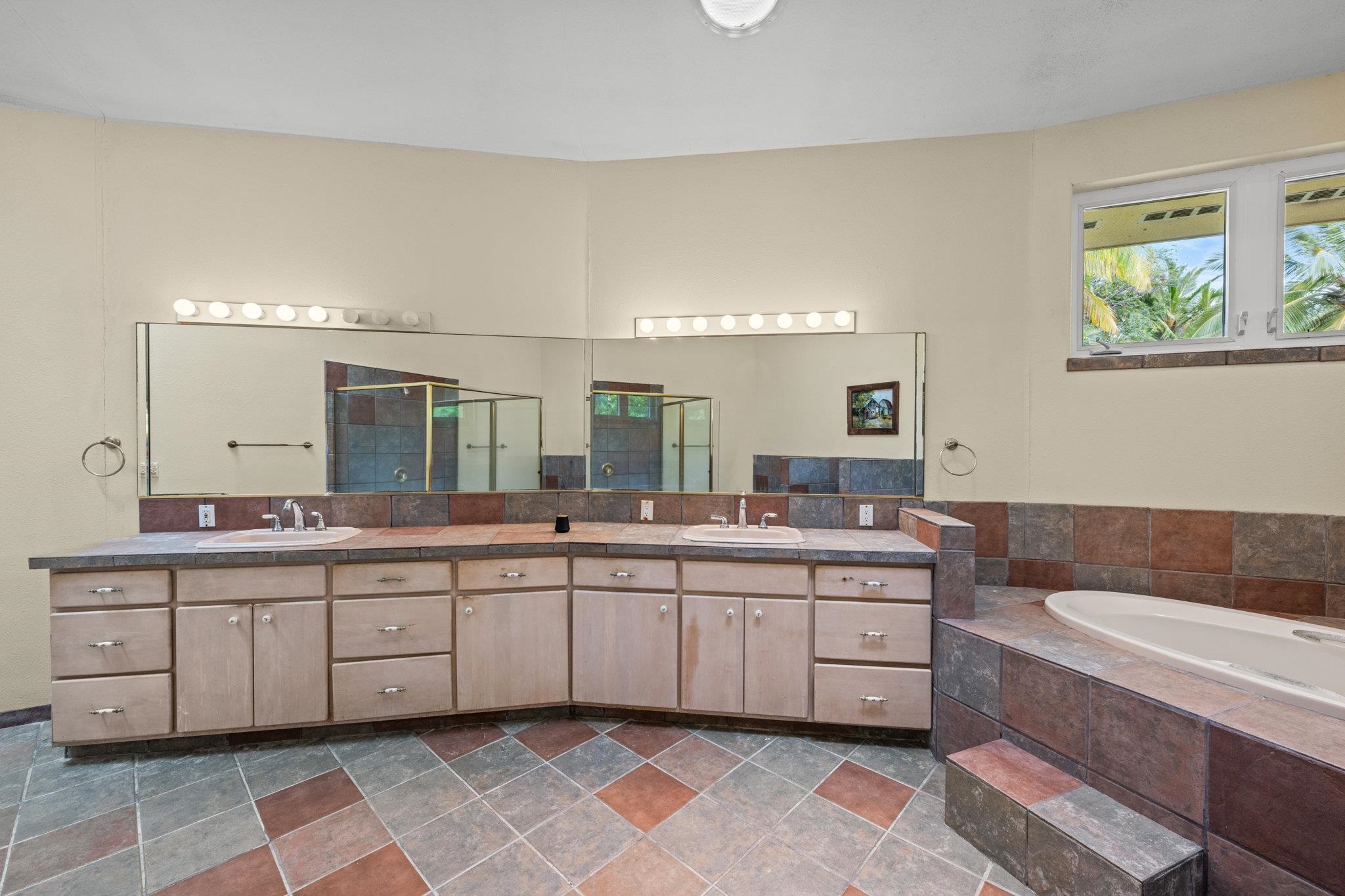 155 Uwala Road Hana, HI 96713 - Photo 23 of 41 a spacious bathroom with a double vanity sink mirror and bathtub