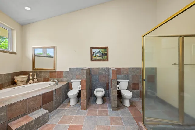 a bed room with a bed and a mirror