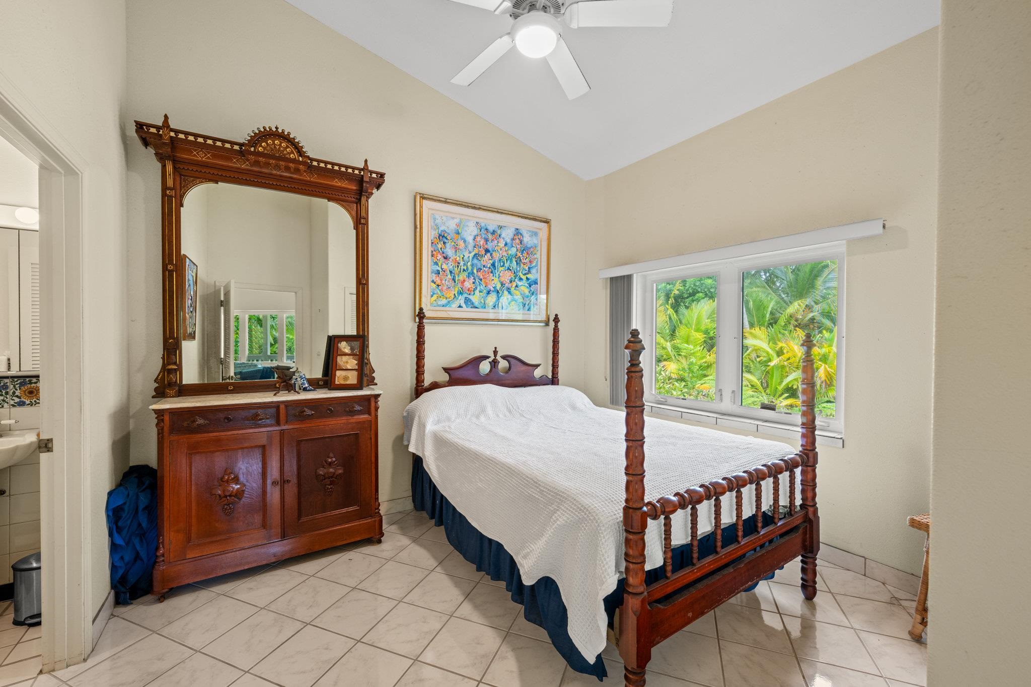 155 Uwala Road Hana, HI 96713 - Photo 26 of 41 a bed room with a bed and a mirror