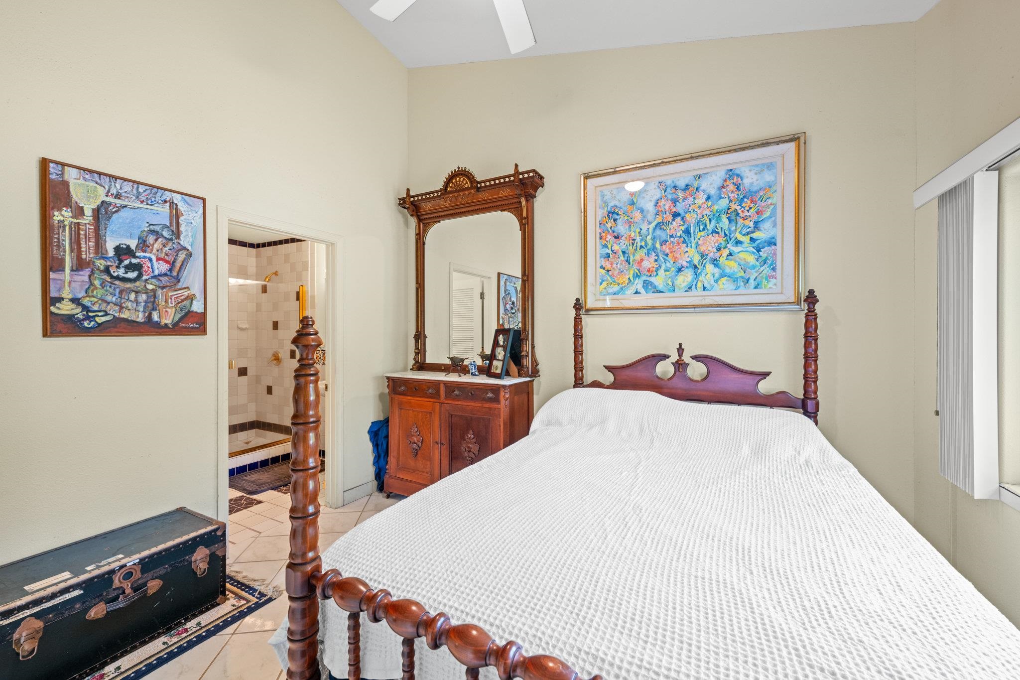 155 Uwala Road Hana, HI 96713 - Photo 27 of 41 a bed room with furniture and paintings on the wall