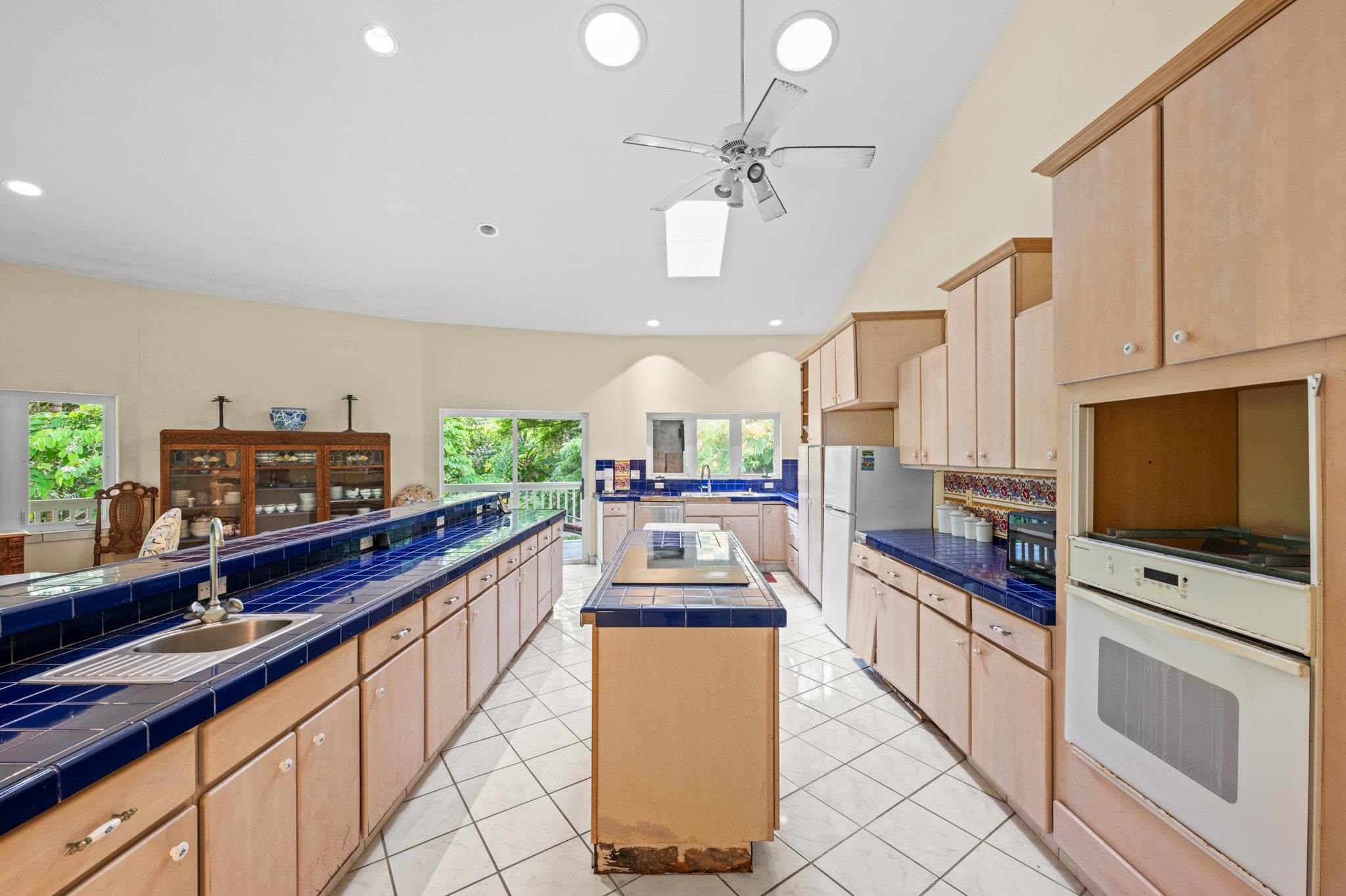 155 Uwala Road Hana, HI 96713 - Photo 10 of 41 a kitchen with stainless steel appliances a sink counter space and cabinets