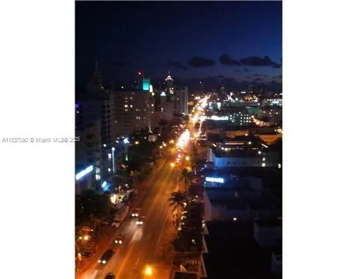 a living room with furniture a rug and white walls