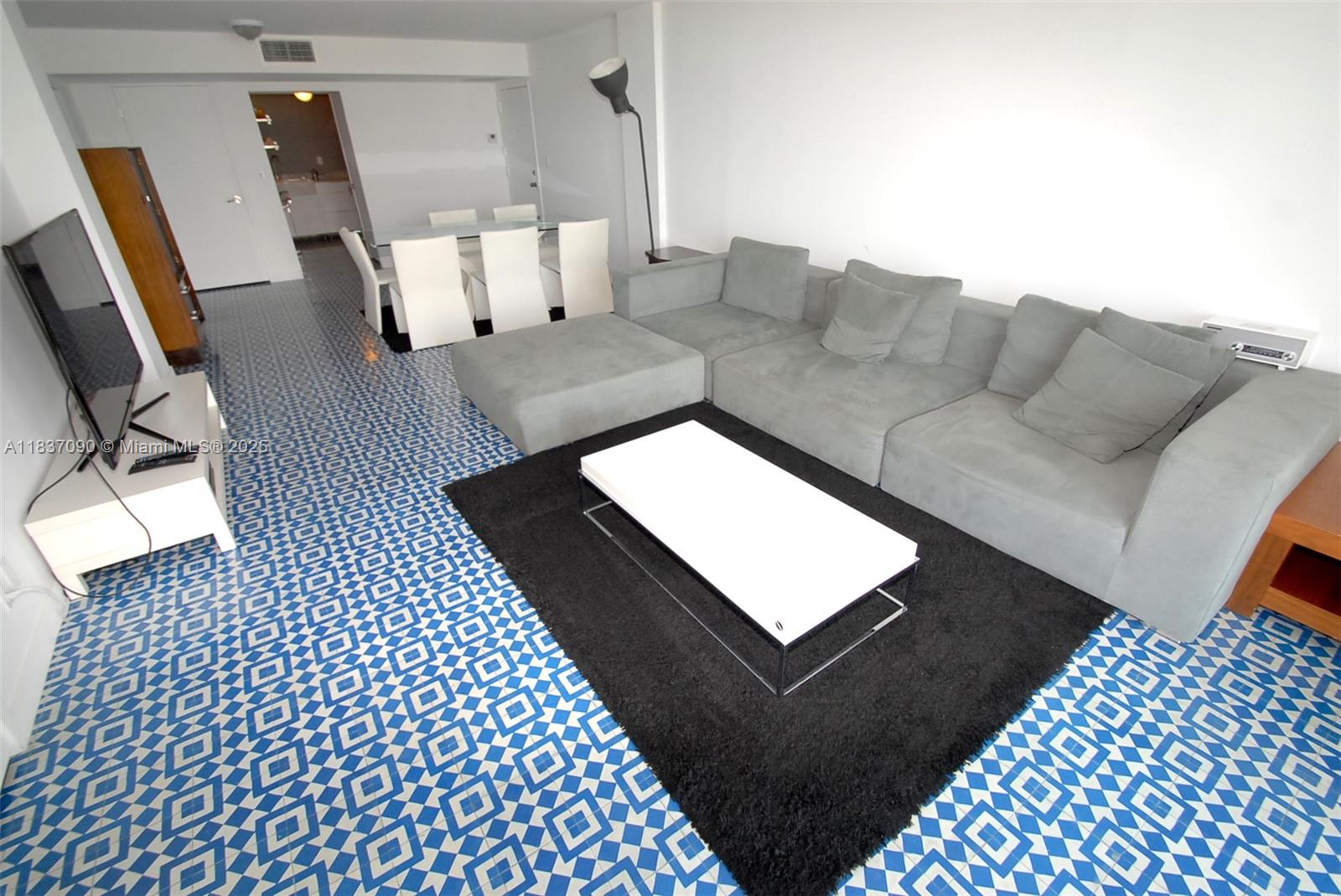 1800 Collins Avenue, Unit 18F Miami Beach, FL 33139 - Photo 2 of 22 a living room with a couch