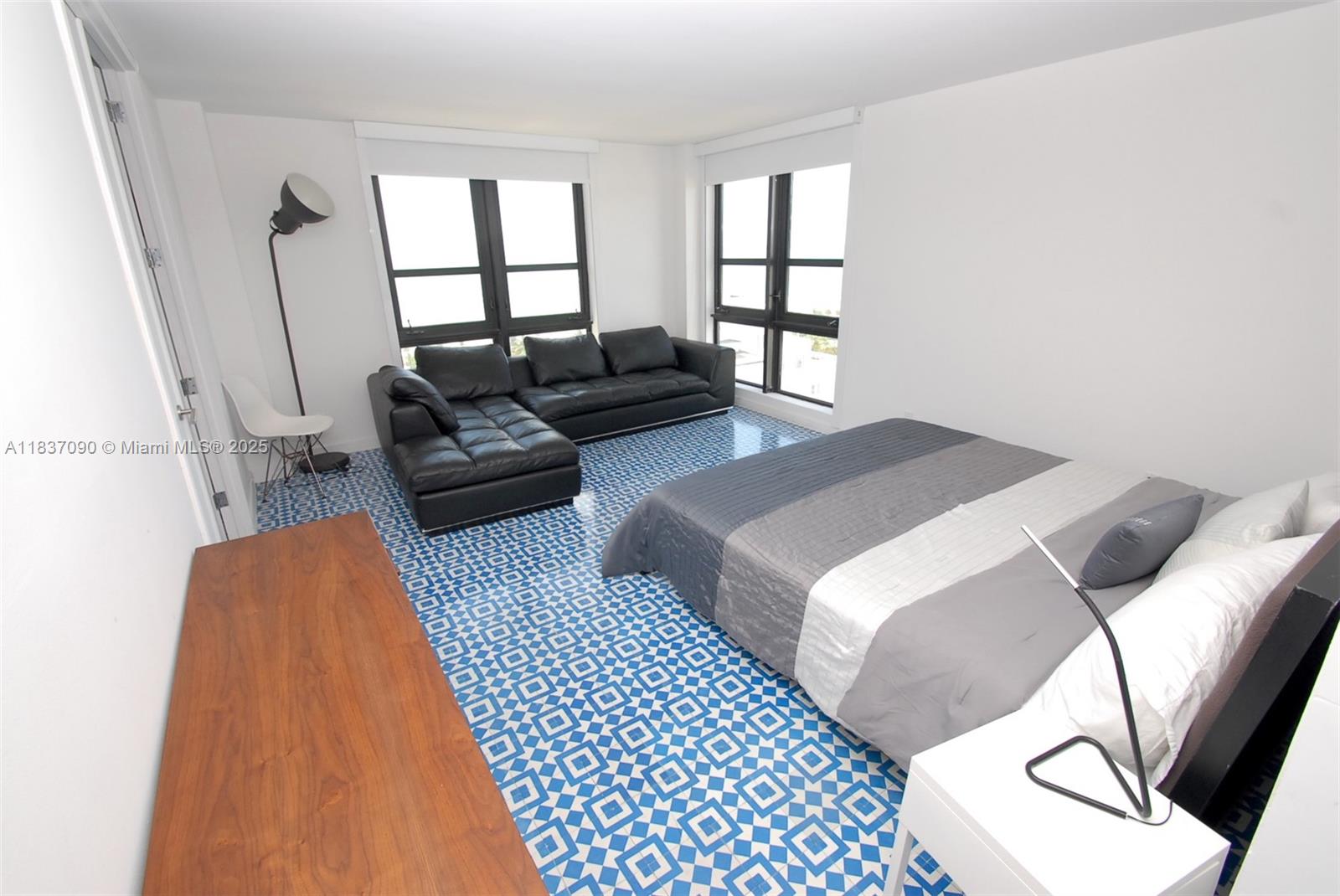 1800 Collins Avenue, Unit 18F Miami Beach, FL 33139 - Photo 10 of 22 a bedroom with a bed and a couch