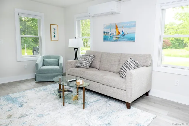 a living room with furniture and a window