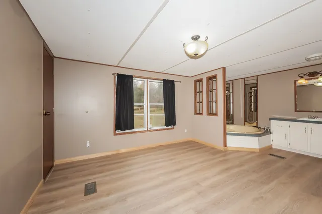 a view of an empty room with a window