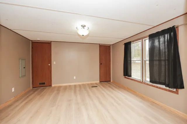 a bathroom with a granite countertop sink mirror and a bathtub