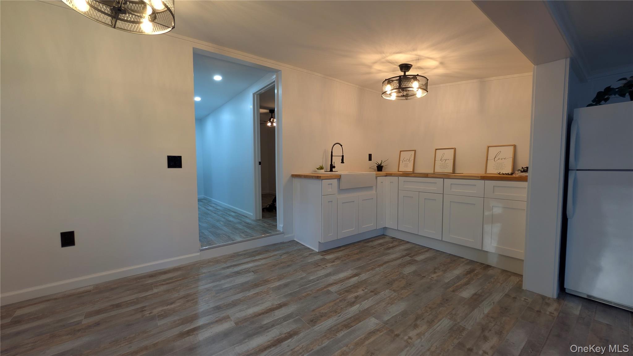 191 Sylvan Lake Road, Unit 30 Hopewell Junction, NY 12533 - Photo 16 of 37 a kitchen with a sink and chandelier