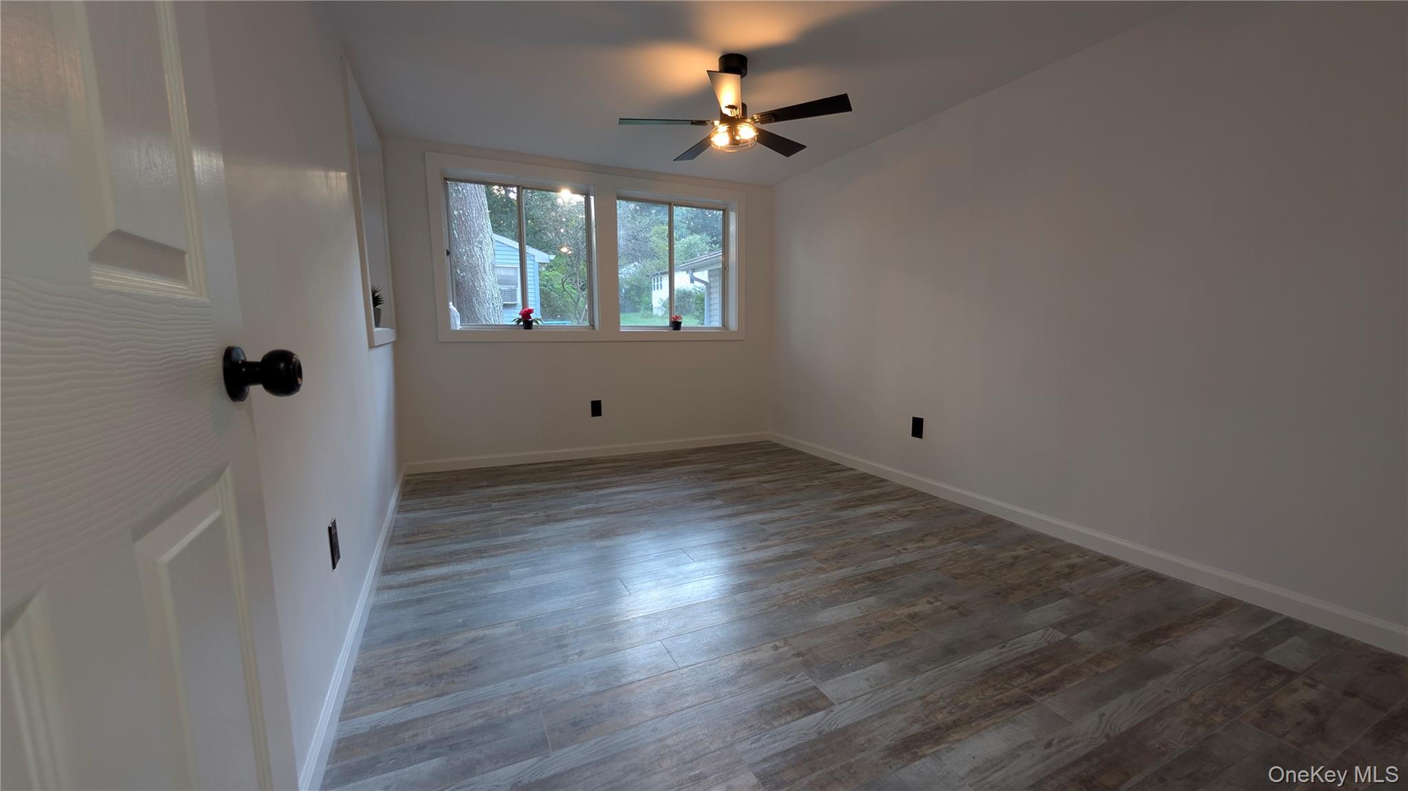 191 Sylvan Lake Road, Unit 30 Hopewell Junction, NY 12533 - Photo 19 of 37 wooden floor in an empty room with a window
