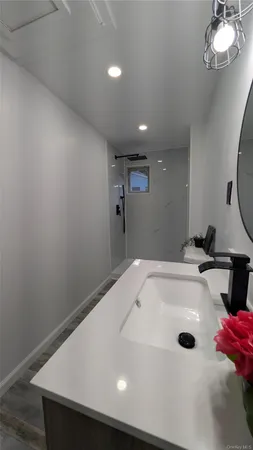 a bathroom with a tub and a shower