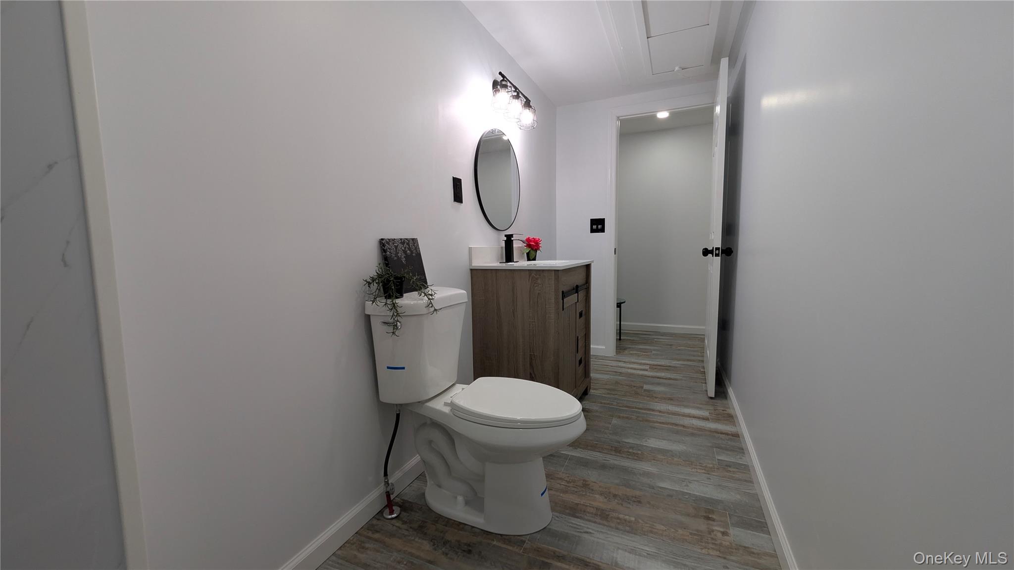 191 Sylvan Lake Road, Unit 30 Hopewell Junction, NY 12533 - Photo 24 of 34 a bathroom with a toilet and a mirror