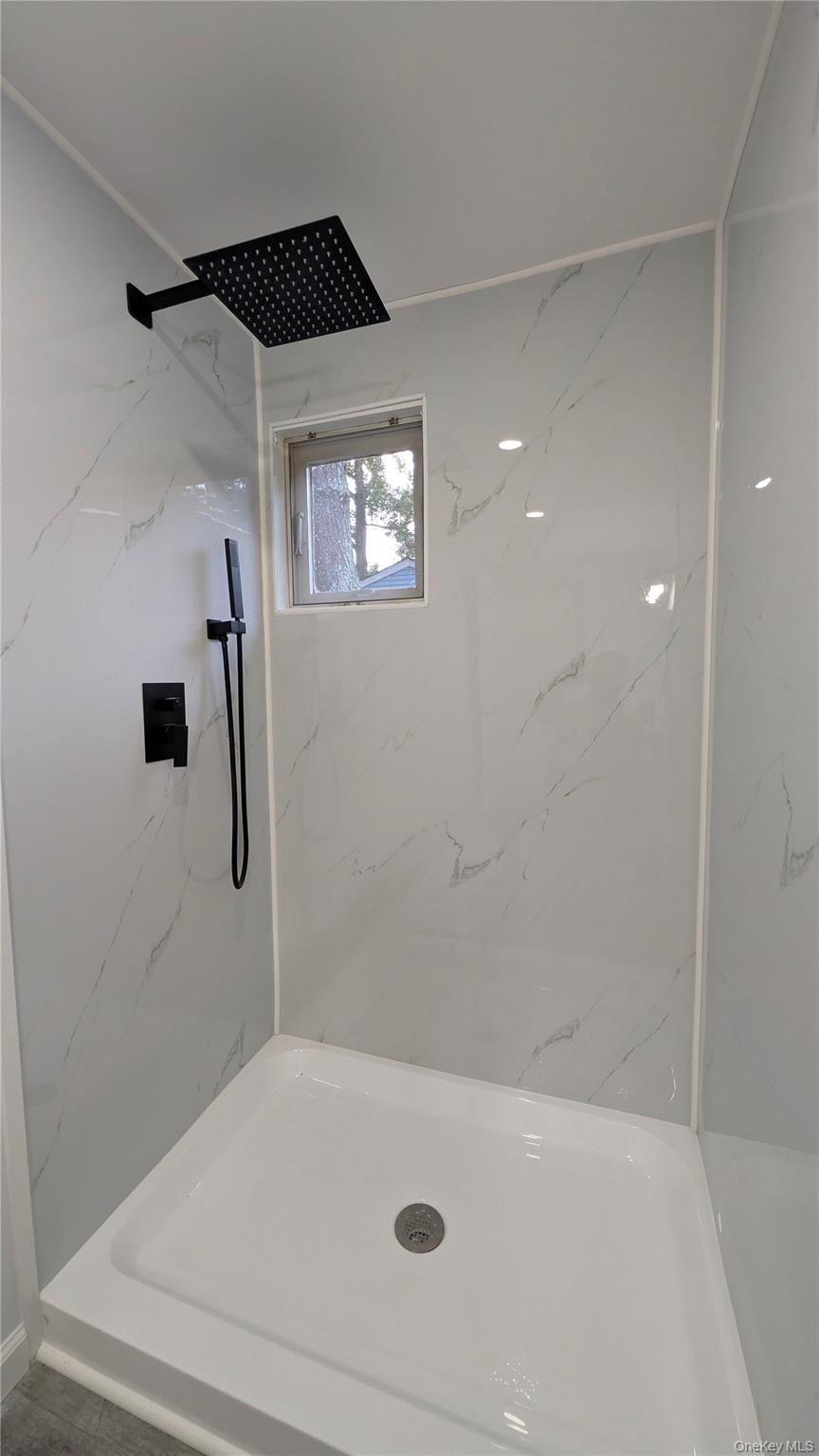 191 Sylvan Lake Road, Unit 30 Hopewell Junction, NY 12533 - Photo 25 of 37 a bathroom with a tub and a shower