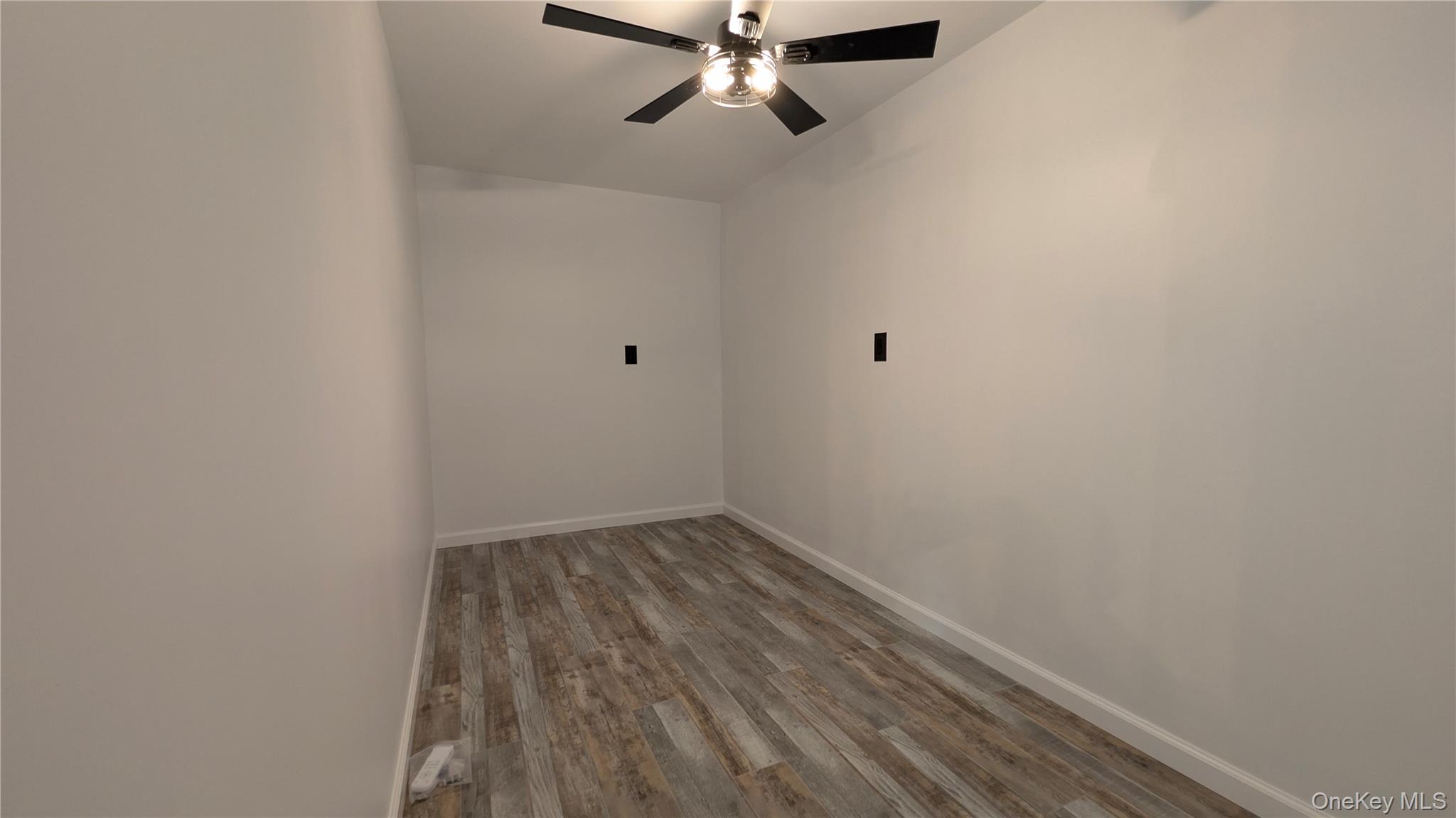 191 Sylvan Lake Road, Unit 30 Hopewell Junction, NY 12533 - Photo 26 of 34 a view of a room with wooden floor and fan