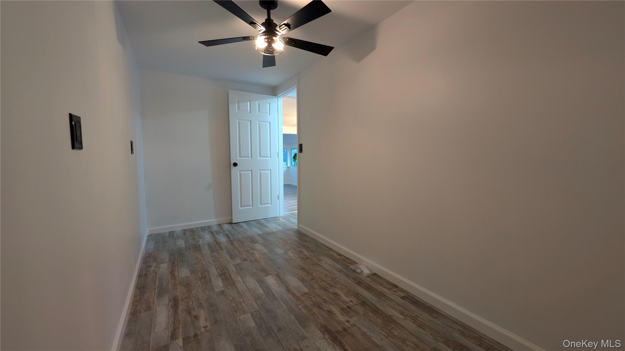 191 Sylvan Lake Road, Unit 30 Hopewell Junction, NY 12533 - Photo 30 of 37 a view of empty room with wooden floor