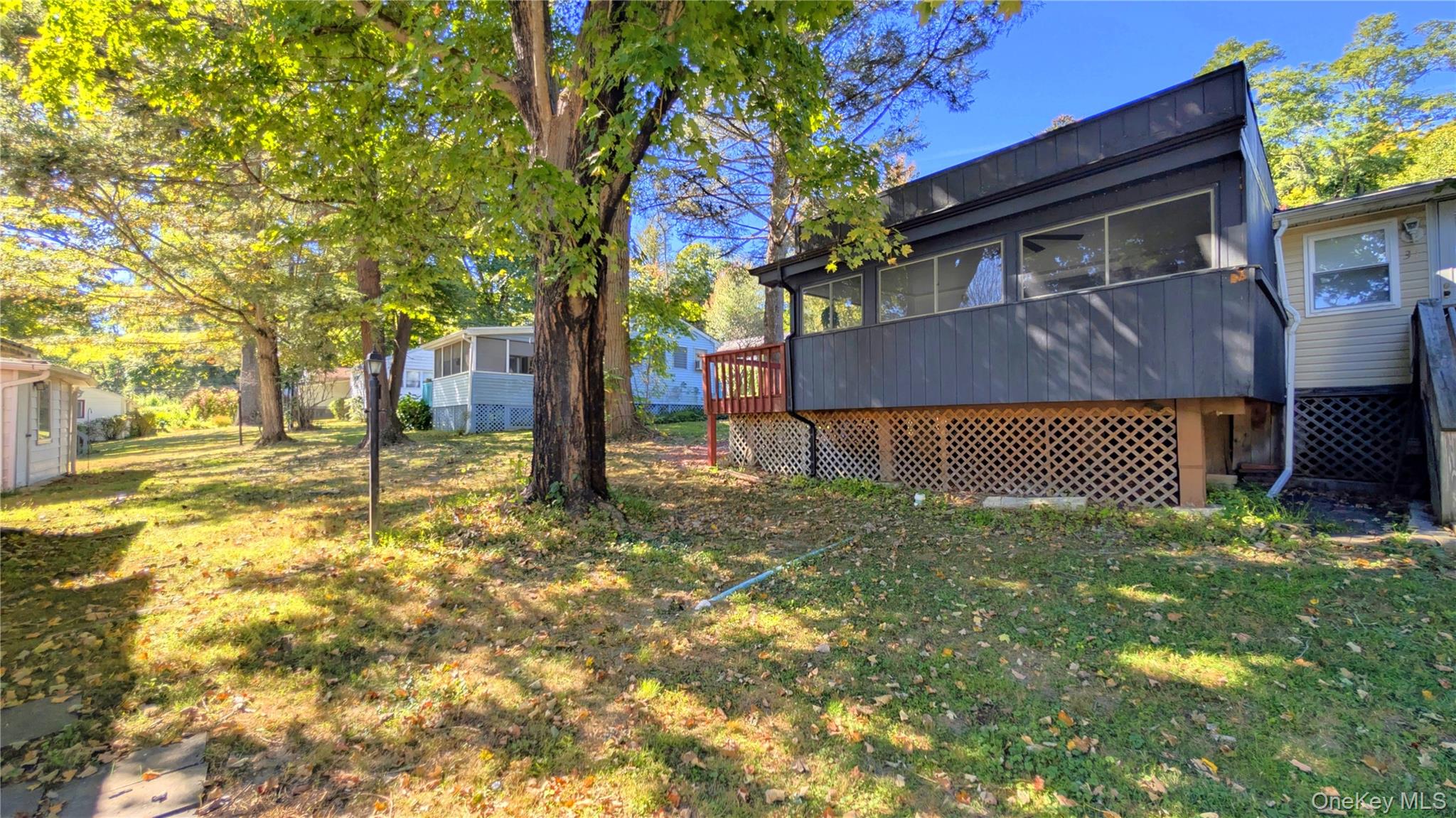 191 Sylvan Lake Road, Unit 30 Hopewell Junction, NY 12533 - Photo 5 of 34 a backyard of a house with table and chairs