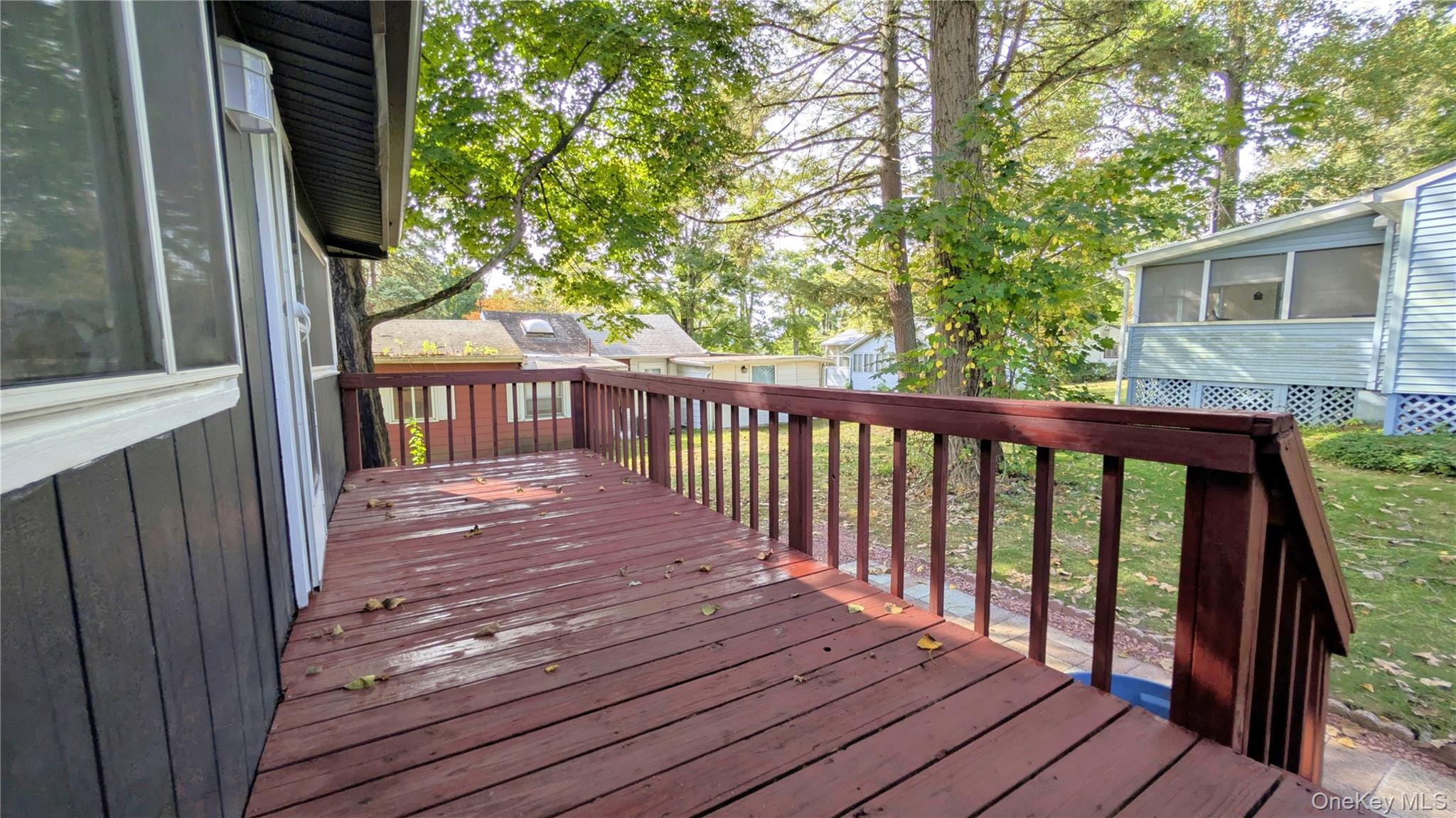 191 Sylvan Lake Road, Unit 30 Hopewell Junction, NY 12533 - Photo 8 of 34 a view of deck with wooden floor and fence