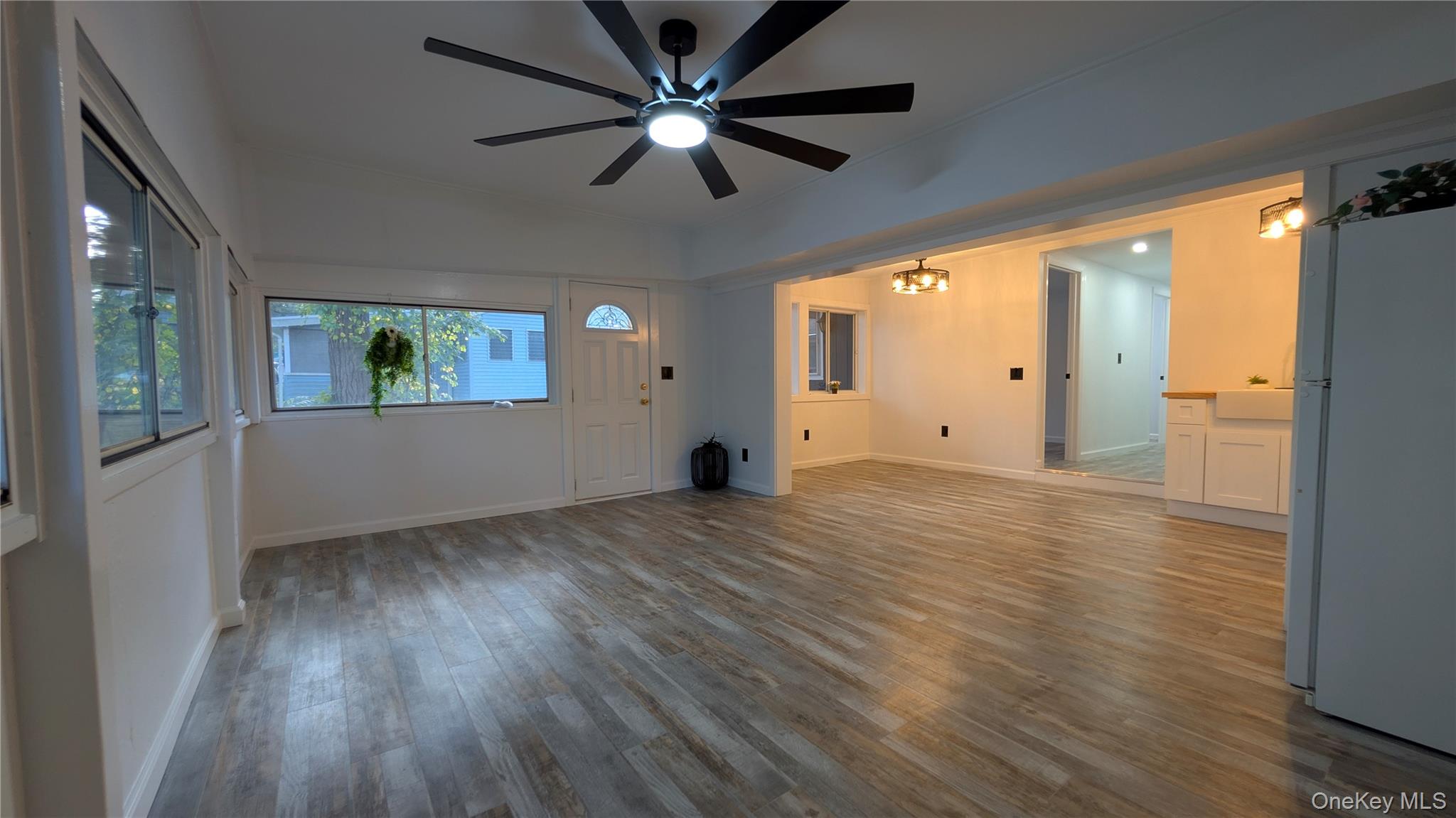 191 Sylvan Lake Road, Unit 30 Hopewell Junction, NY 12533 - Photo 10 of 34 a view of an empty room with wooden floor and a window
