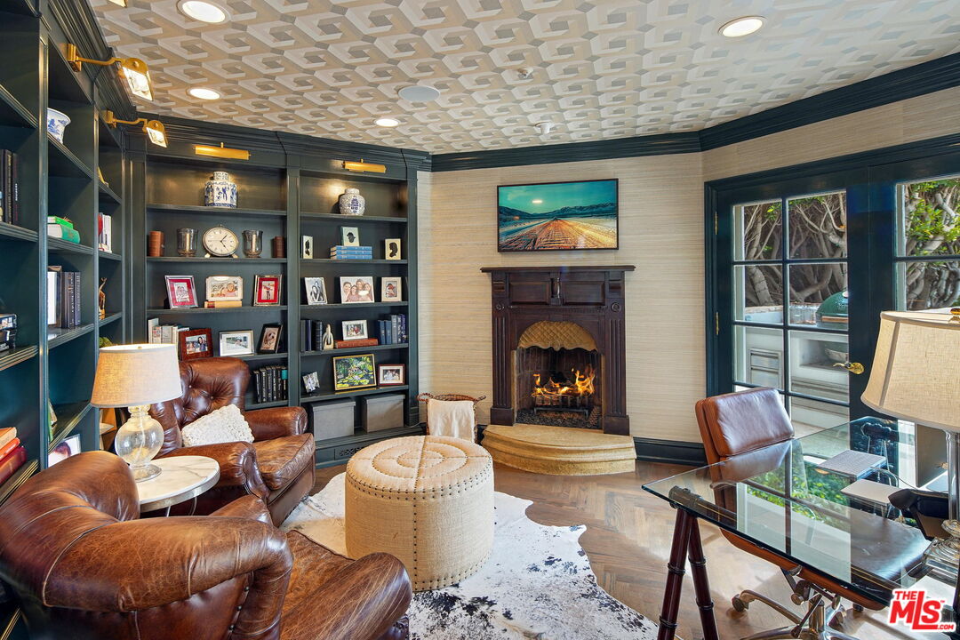 541 Paseo Miramar Pacific Palisades, CA 90272 - Photo 12 of 50 a living room with furniture a rug and a fireplace