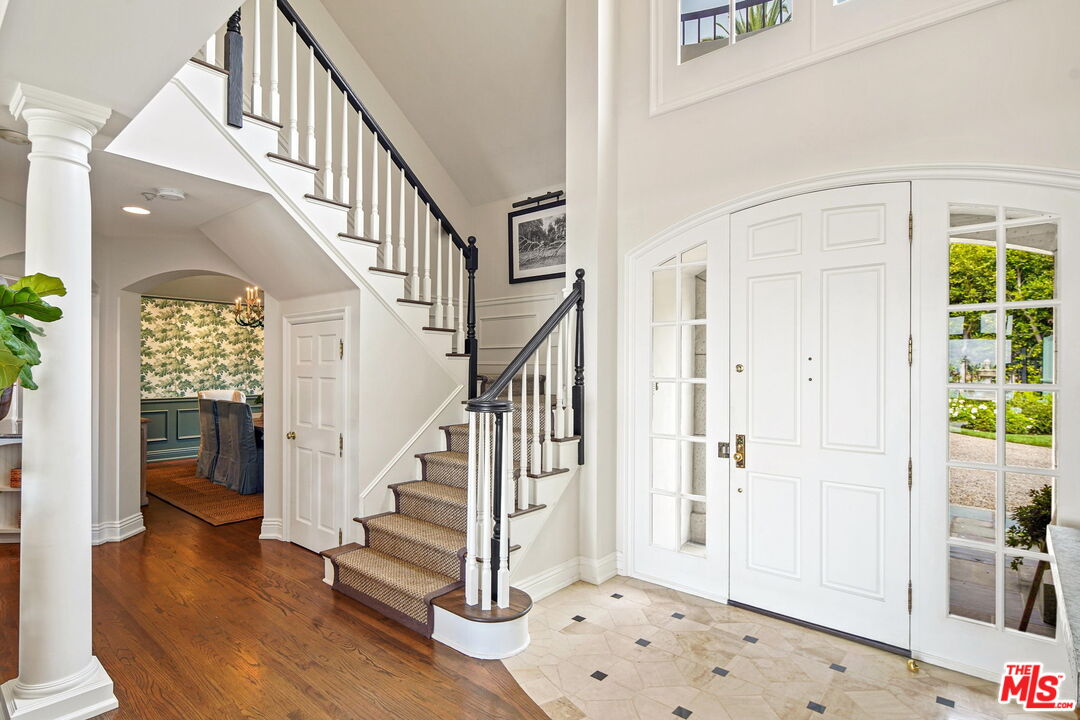 541 Paseo Miramar Pacific Palisades, CA 90272 - Photo 13 of 50 a view of entryway with wooden floor and stairs