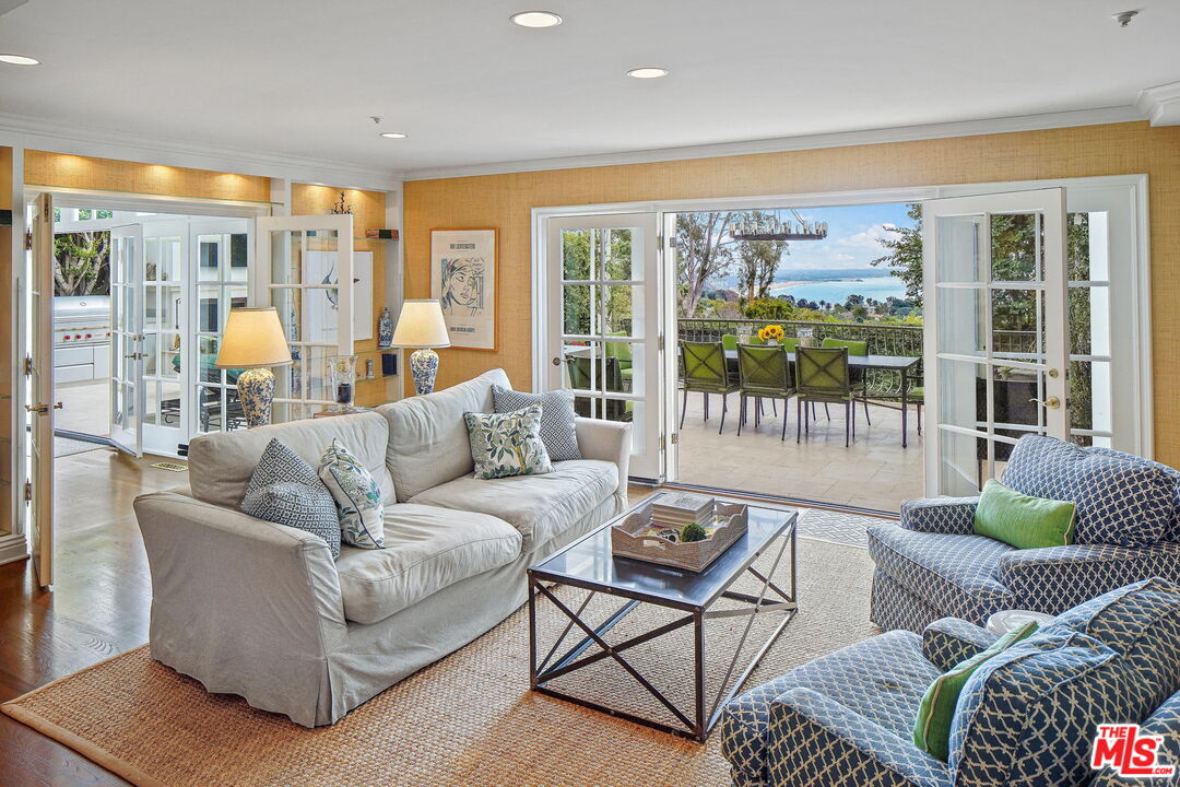 541 Paseo Miramar Pacific Palisades, CA 90272 - Photo 18 of 50 a living room with furniture and a large window