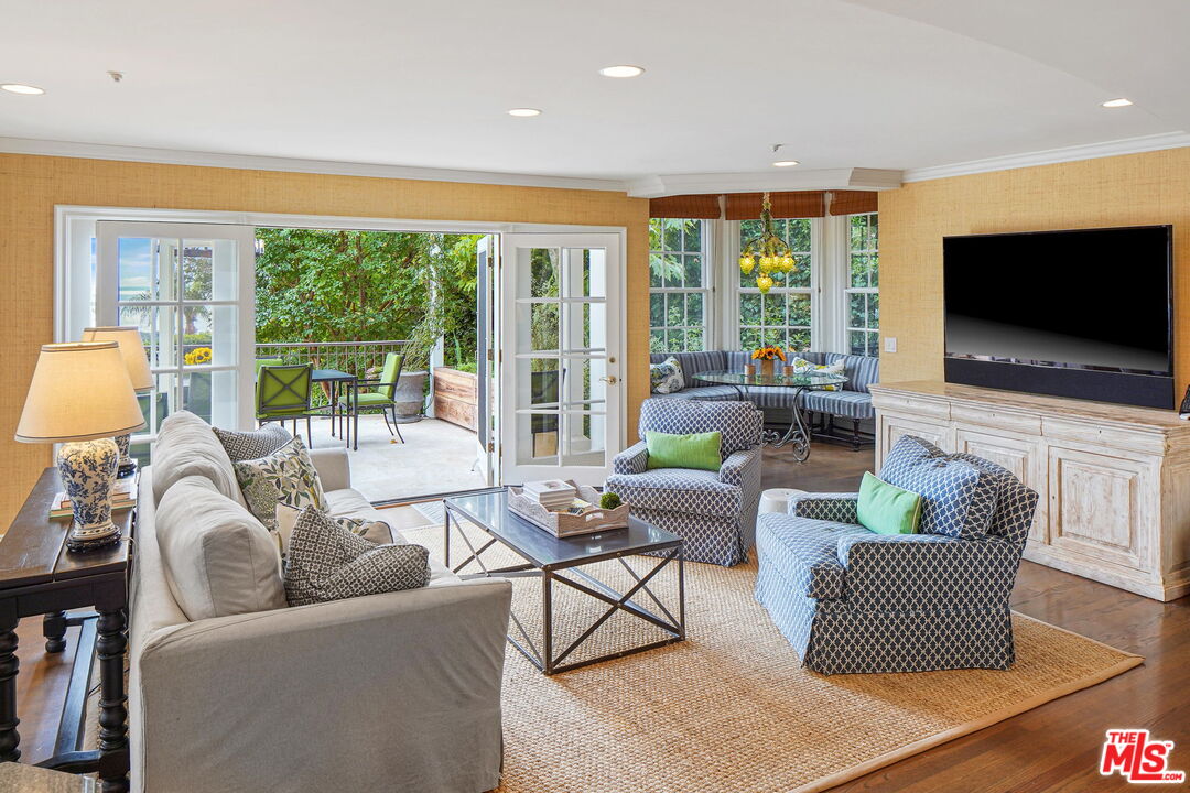 541 Paseo Miramar Pacific Palisades, CA 90272 - Photo 19 of 50 a living room with furniture and a flat screen tv