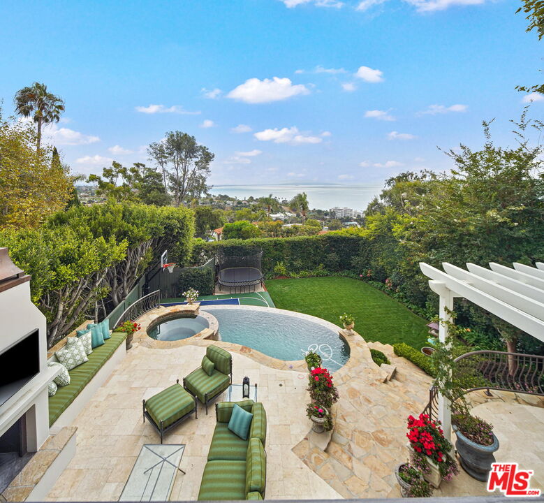541 Paseo Miramar Pacific Palisades, CA 90272 - Photo 27 of 50 a view of a swimming pool with a patio