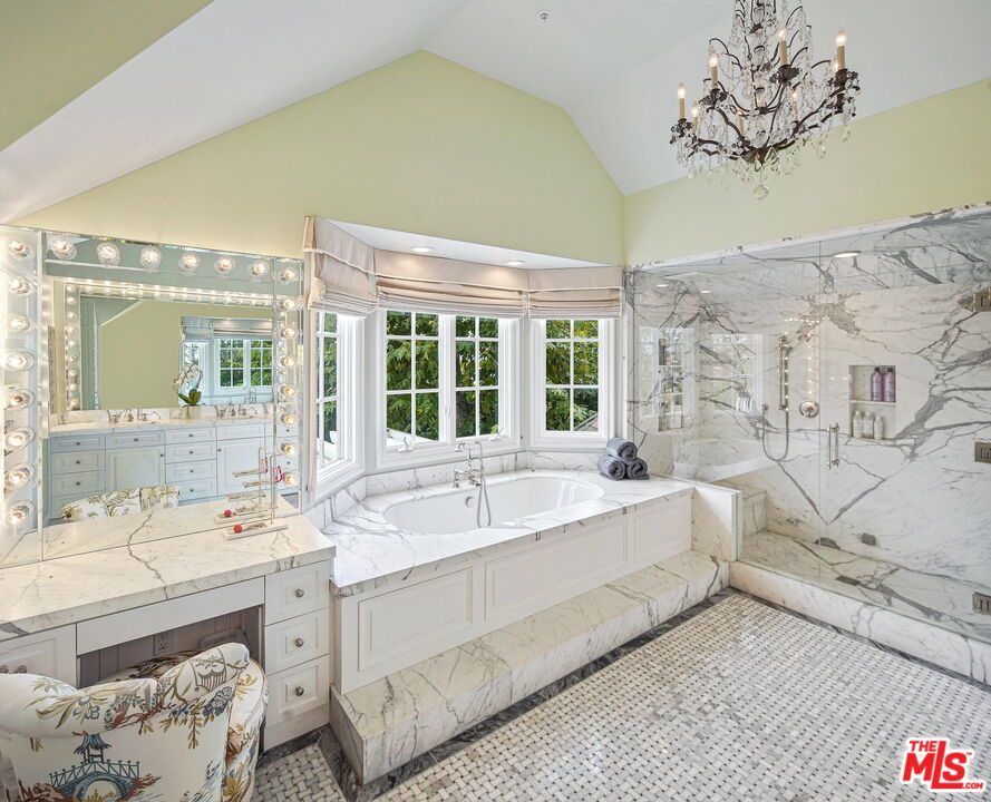 541 Paseo Miramar Pacific Palisades, CA 90272 - Photo 28 of 50 a spacious bathroom with a double vanity sink mirror and bathtub