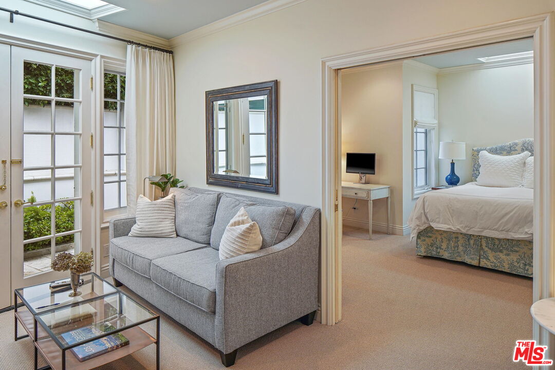 541 Paseo Miramar Pacific Palisades, CA 90272 - Photo 31 of 50 a living room with furniture and a large window