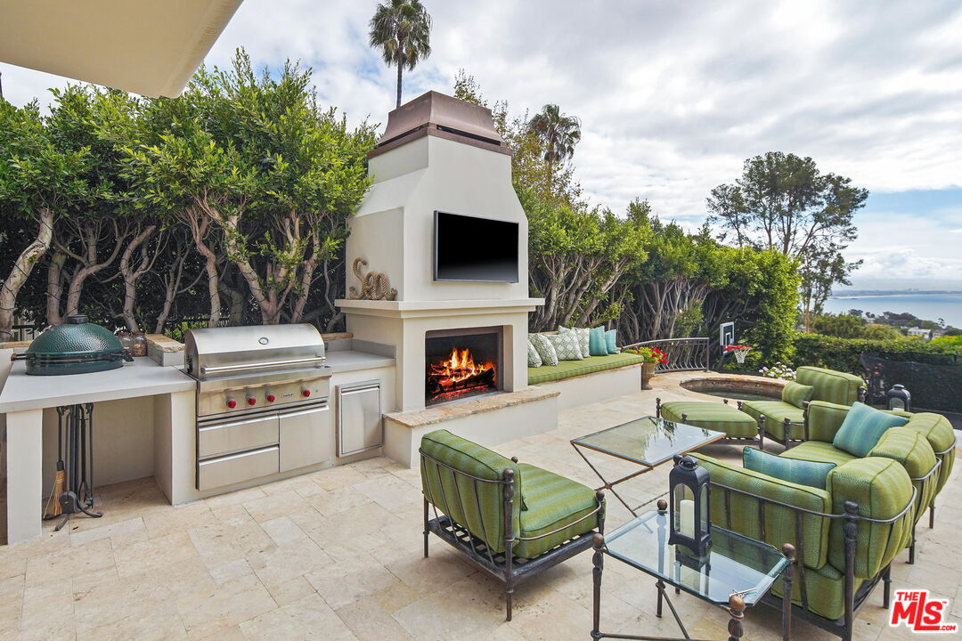 541 Paseo Miramar Pacific Palisades, CA 90272 - Photo 33 of 50 a bedroom with a bed chair and a window