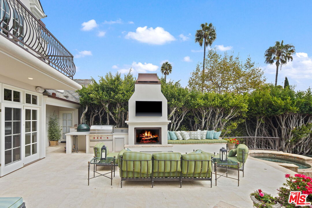 541 Paseo Miramar Pacific Palisades, CA 90272 - Photo 35 of 50 a view of a chairs and tables in the back yard of the house