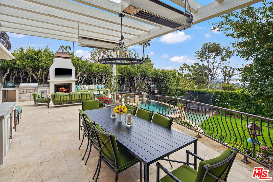 541 Paseo Miramar Pacific Palisades, CA 90272 - Photo 36 of 50 a view of a house with swimming pool and sitting area