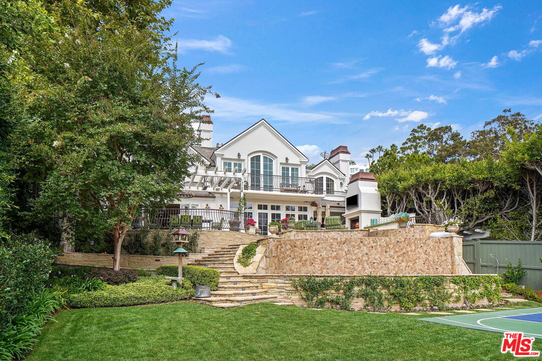 541 Paseo Miramar Pacific Palisades, CA 90272 - Photo 41 of 50 a view of a house with a yard