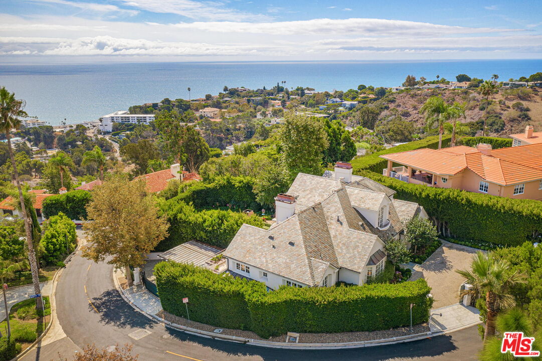 541 Paseo Miramar Pacific Palisades, CA 90272 - Photo 42 of 50 a front view of a house with a garden