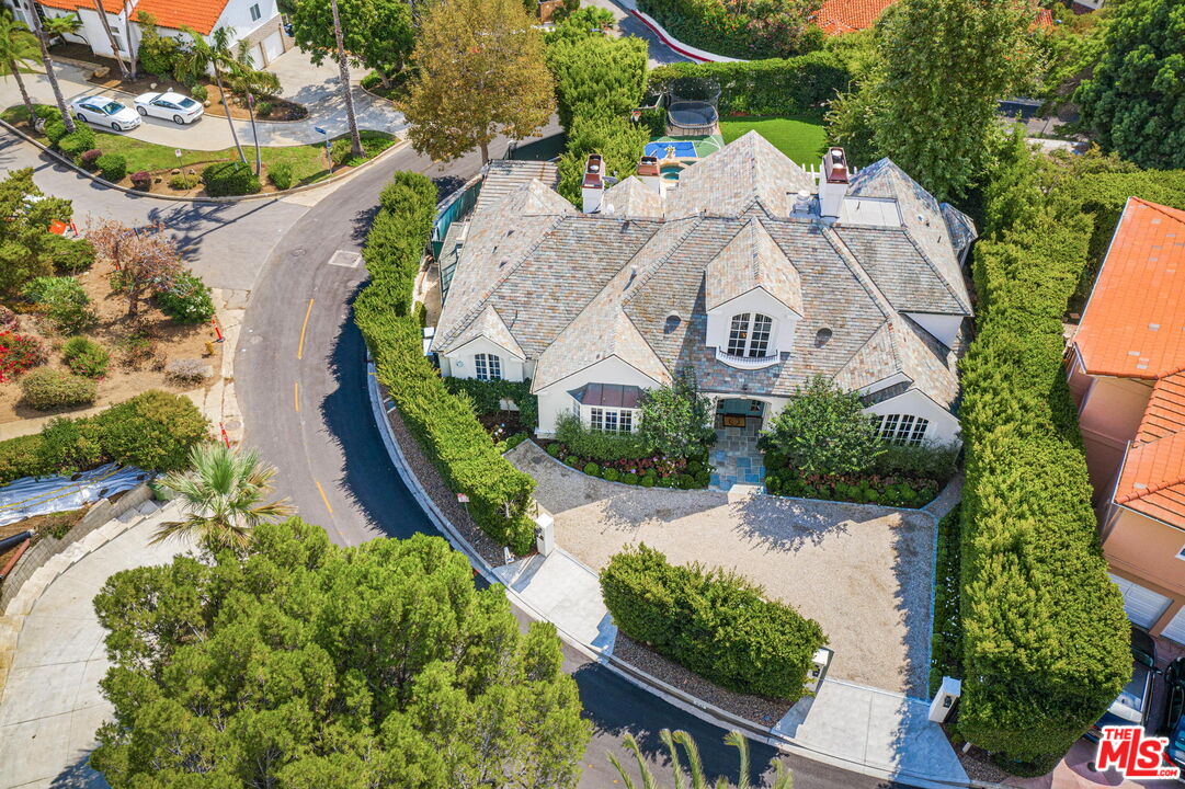 541 Paseo Miramar Pacific Palisades, CA 90272 - Photo 43 of 50 a view of a swimming pool with a yard and lake